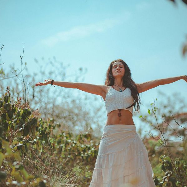 Person meditating in a calm, balanced environment.